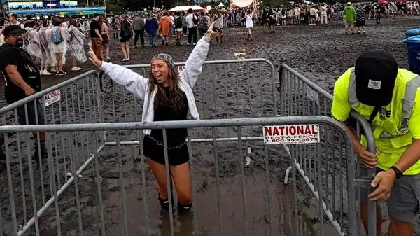 Lollapalooza Grounds Trap Woman in Knee-Deep Mud Pit