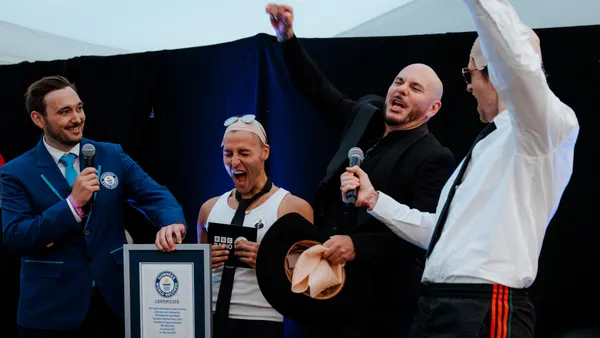 Pitbull Sets Guinness World Record for Largest Gathering of People in Bald Caps