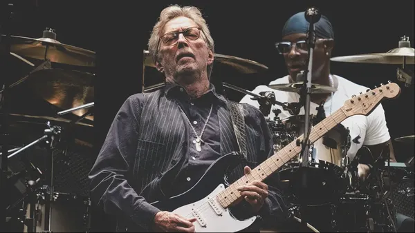 Eric Clapton Leaves Stage After Being Hit by Vinyl Record Thrown by Audience Member