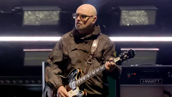 Oasis Guitarist Paul “Bonehead” Arthurs to Miss Tour Dates for Cancer Treatment